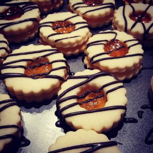 Jumbo Jam cookies with chocolate lines on a cookie tray.