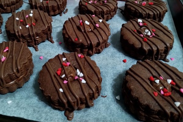 Jumbo Sandwich chocolate Cookies with Nutella on a baking tray