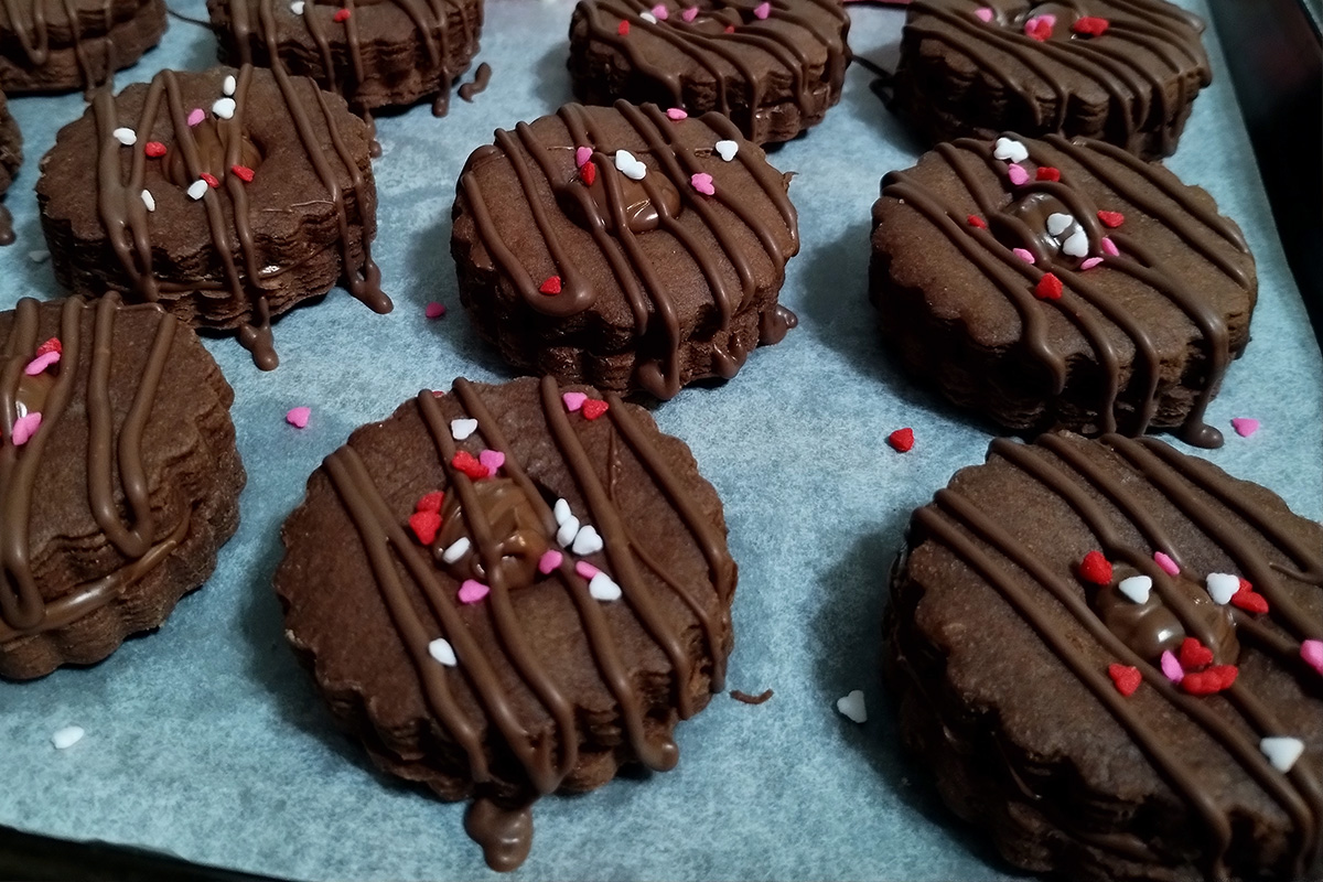 Jumbo Sandwich chocolate Cookies with Nutella on a baking tray
