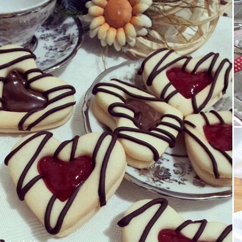 Heart shaped cookie with vanilla dough and raspberry jam.