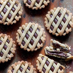 Italian Nutella tarts on a wooden board.