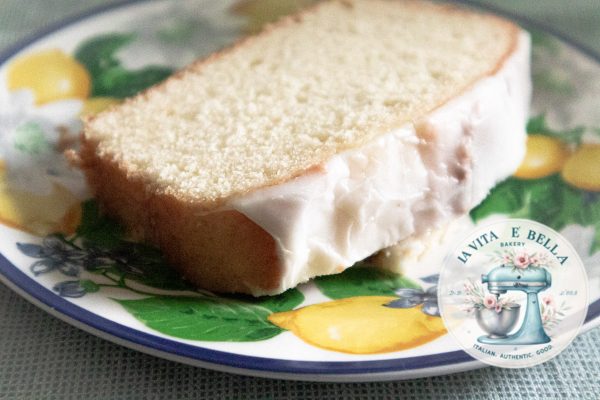 Limoncello cake on a dish with lemons stamps.