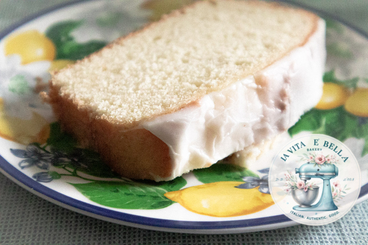 Limoncello cake on a dish with lemons stamps.