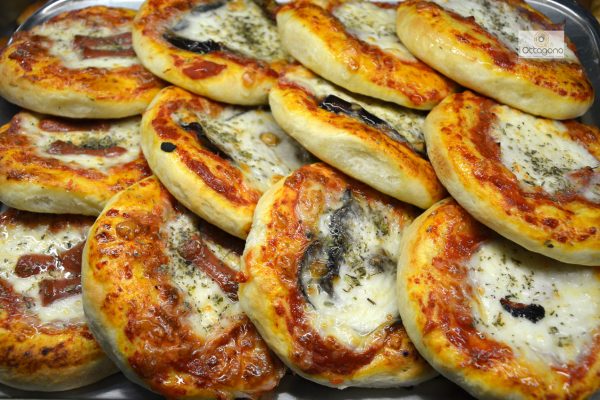 Sicilian mini pizzas for parties plain mozzarella and cheese.