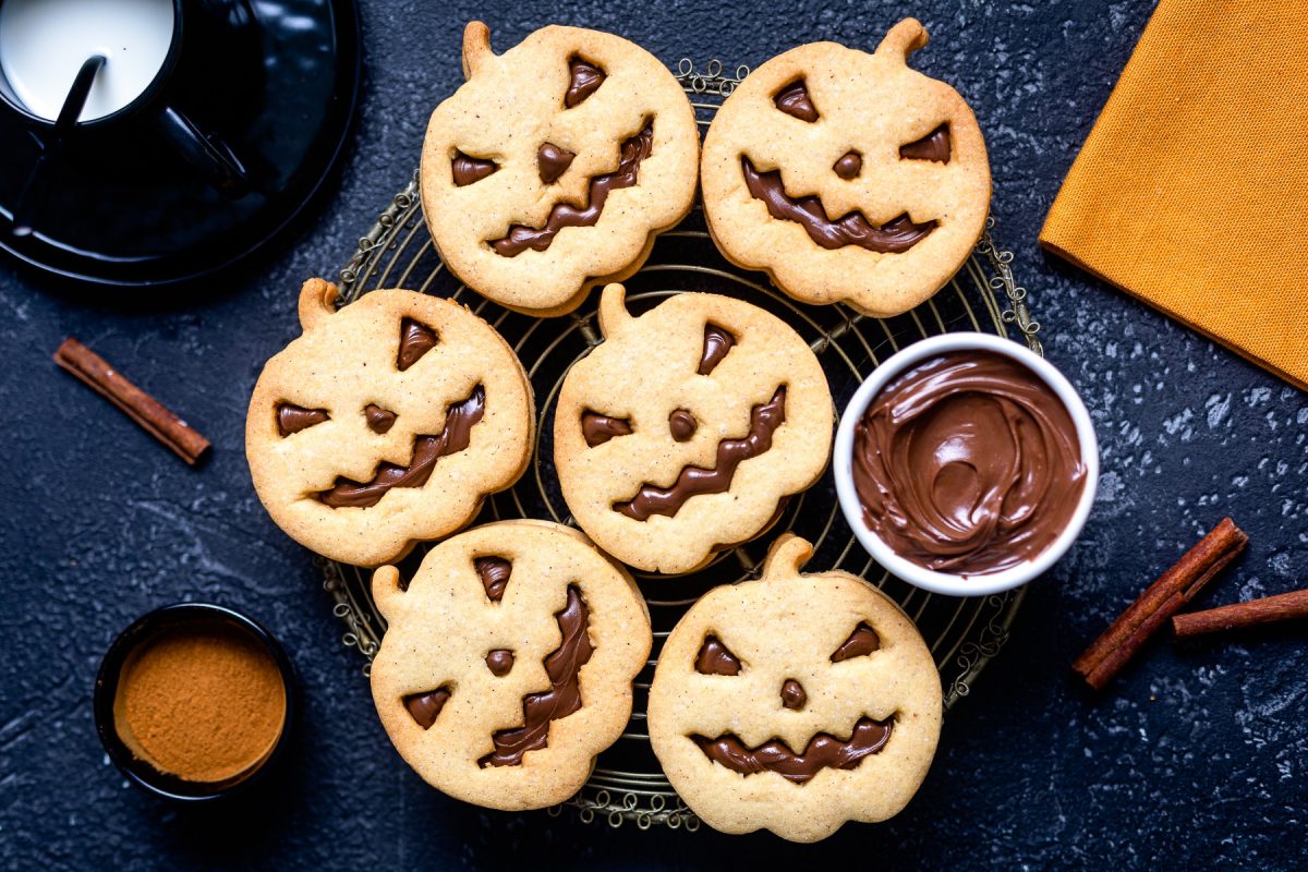 halloween cookies, pumpkin shaped on a tray.