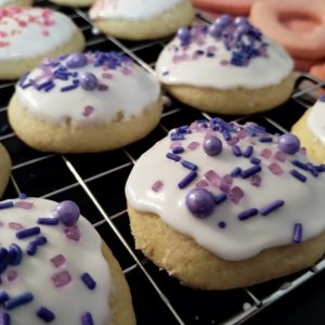 Ricotta cheese cookies with purple sprinkles closeup.