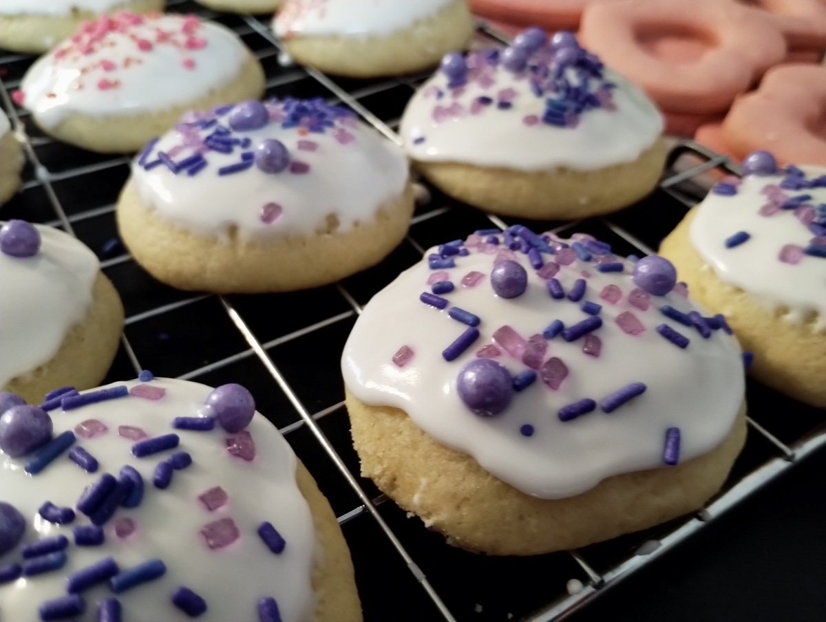 Ricotta cheese cookies with purple sprinkles closeup.